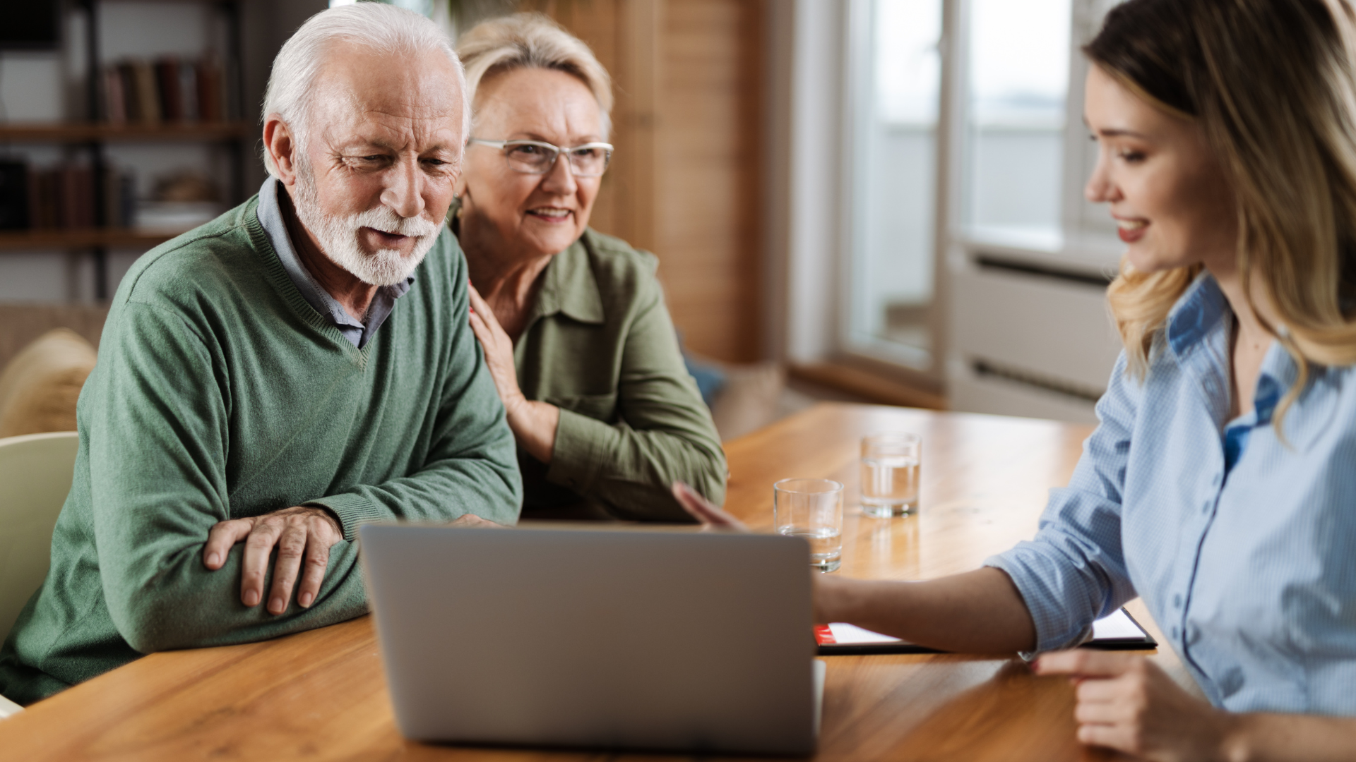 Talk A senior couple talking with an insurance agent for Medicare