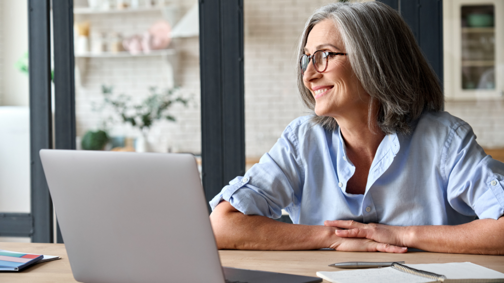 A woman looking at the window smiling